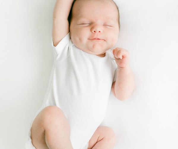 Person stretching peacefully with a serene background.